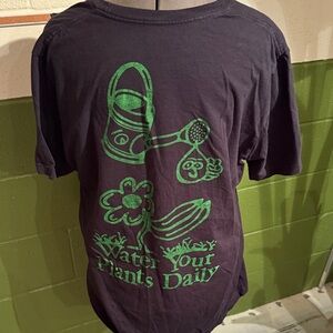 Altru Black Tee with Green water your plants daily